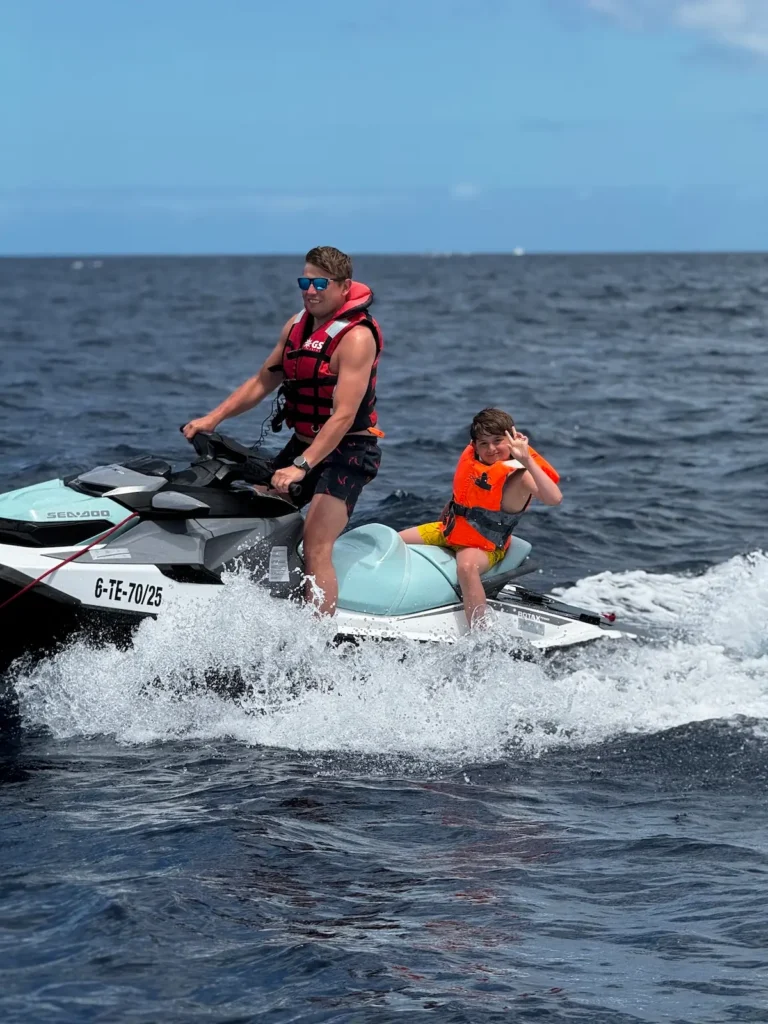 The Most Common Concerns Before Booking a Jet Ski Safari in Tenerife – And Why You Don’t Need to Worry 12 Jet Ski Safari in Adeje – father son jet ski riding on the waves